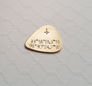 custom bronze guitar pick with coordinates