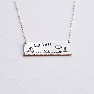 Silver bar necklace with sailboat, sunrise, and lighthouse