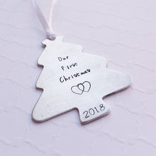 Load image into Gallery viewer, &quot;our first christmas&quot; tree-shaped christmas ornament with interlocking hearts and year