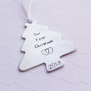 "our first christmas" tree-shaped christmas ornament with interlocking hearts and year
