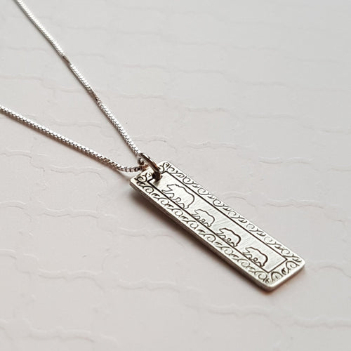 Silver bar necklace with swirly border and mama and baby bears