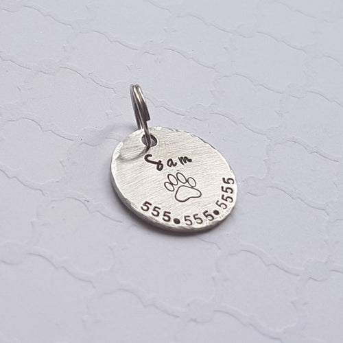 tiny pet name tag with paw print for dog or cat