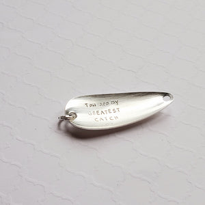 "Greatest catch" stamped fishing lure