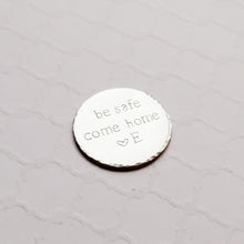 Load image into Gallery viewer, steel pocket token stamped with &quot;be safe come home&quot;