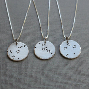 zodiac constellation stamped silver disc necklace